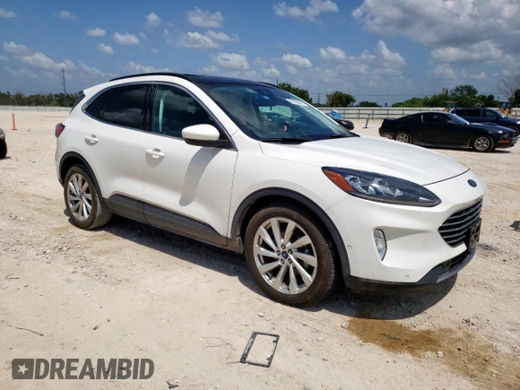 2021 Ford Escape Titanium Hybrid z VIN 1FMCU0DZ6MUA03327, wystawiony jako Copart lot #59558845 z przebiegiem 67 569 mil mil oraz Czysty tytuł • Clean title. Historia ofert i sprzedaży dostępna na DreamBid. Obrazek 4.
