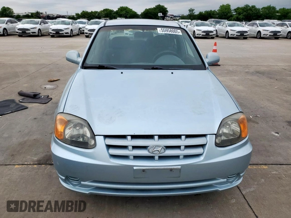 2003 Hyundai Accent GL z VIN KMHCG45C73U481294, wystawiony jako Copart lot #55958005 z przebiegiem 136 964 mil mil oraz Czysty tytuł • Clean title. Historia ofert i sprzedaży dostępna na DreamBid. Obrazek 5.