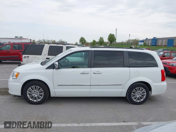 2015 Chrysler Town & Country Touring-L with VIN 2C4RC1CG9FR573863, listed as a IAAI auction lot 42036034 with 141,390 mi miles. Bid and sale history available at carsss.com. Image 14.