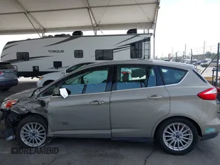 2015 Ford C-Max SEL z VIN 1FADP5CU8FL100255, wystawiony jako IAAI lot #42183172 z przebiegiem 101 606 mil mil oraz . Historia ofert i sprzedaży dostępna na DreamBid. Obrazek 15.