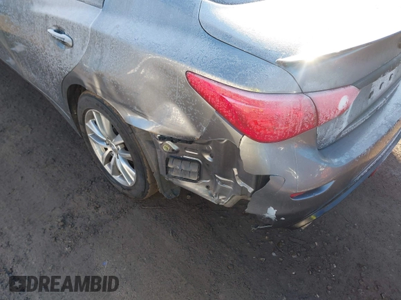 2015 Infiniti Q50 Premium z VIN JN1BV7AR2FM423666, wystawiony jako IAAI lot #41345228 z przebiegiem 67 027 mil mil oraz . Historia ofert i sprzedaży dostępna na DreamBid. Obrazek 6.