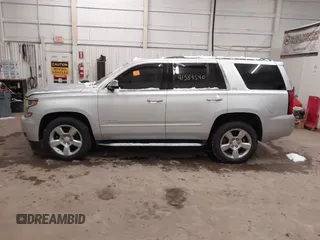 2016 Chevrolet Tahoe LTZ z VIN 1GNSKCKCXGR284827, wystawiony jako IAAI lot #41389540 z przebiegiem 93 150 mil mil oraz . Historia ofert i sprzedaży dostępna na DreamBid. Obrazek 14.