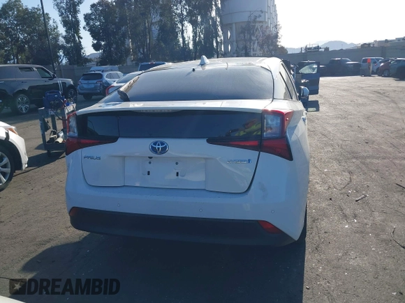 2021 Toyota Prius L Eco with VIN JTDKAMFU0M3149875, listed as a IAAI auction lot 41966010 with 99,542 mi miles. Bid and sale history available at carsss.com. Image 17.