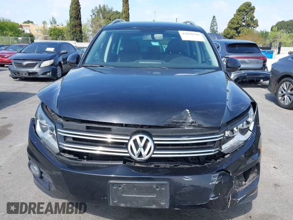 2015 Volkswagen Tiguan SE with VIN WVGAV7AX5FW509612, listed as a IAAI auction lot 42020599 with 64,201 mi miles and . Bid and sale history available at DreamBid. Image 12.