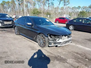 2018 BMW 5 Series M550i xDrive with VIN WBAJB9C57JG463933, listed as a IAAI auction lot 41295711 with 99,173 mi miles. Bid and sale history available at carsss.com. Image 1.