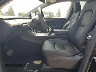 2024 Tesla Model Y Long Range with VIN 7SAYGDEE4RA228916, listed as a Copart auction lot 54921575 with 13,607 mi miles and Salvage title. Bid and sale history available at DreamBid. Image 7.