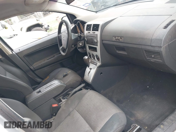2009 Dodge Caliber SXT with VIN 1B3HB48A59D143888, listed as a IAAI auction lot 42110334 with 182,674 mi miles and . Bid and sale history available at DreamBid. Image 5.