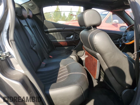 2006 Maserati Quattroporte z VIN ZAMCE39A960026645, wystawiony jako Copart lot #74550174 z przebiegiem 50 591 mil mil oraz Tytuł czysty. Historia ofert i sprzedaży dostępna na DreamBid. Obrazek 10.