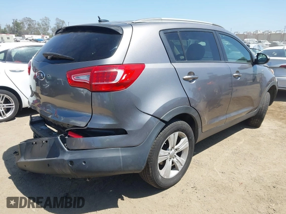 2011 Kia Sportage LX with VIN KNDPBCA20B7170217, listed as a IAAI auction lot 42303069 with 186,994 mi miles and . Bid and sale history available at DreamBid. Image 4.