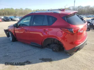 2014 Mazda CX-5 Grand Touring with VIN JM3KE4DY9E0419111, listed as a Copart auction lot 52250315 with 130,003 mi miles and Salvage Title. Bid and sale history available at DreamBid. Image 2.