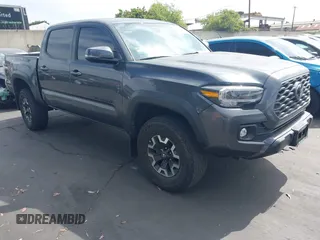 2023 Toyota Tacoma SR with VIN 3TMCZ5AN0PM635933, listed as a IAAI auction lot 42543126 with 32,960 mi miles and . Bid and sale history available at DreamBid. Image 1.