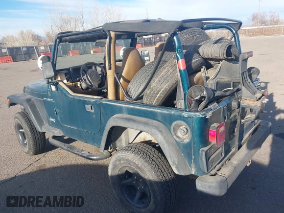 1997 Jeep Wrangler SE with VIN 1J4FY29PXVP409498, listed as a IAAI auction lot 41818698 with 150,086 mi miles. Bid and sale history available at carsss.com. Image 3.