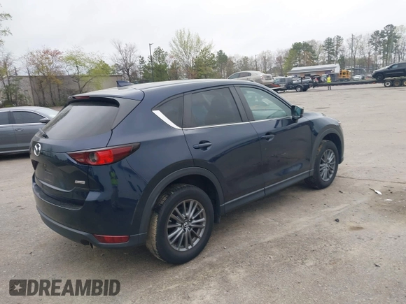 2017 Mazda CX-5 Touring with VIN JM3KFBCL9H0163449, listed as a IAAI auction lot 41919020 with 102,898 mi miles. Bid and sale history available at carsss.com. Image 4.