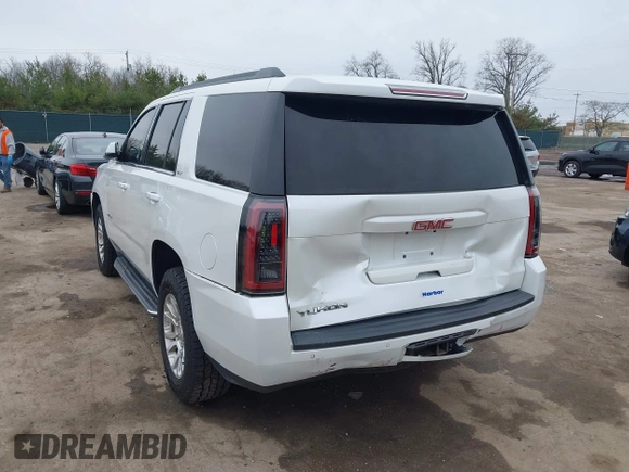 2016 GMC Yukon SLT with VIN 1GKS2BKC5GR374815, listed as a IAAI auction lot 41889495 with 163,464 mi miles. Bid and sale history available at carsss.com. Image 3.