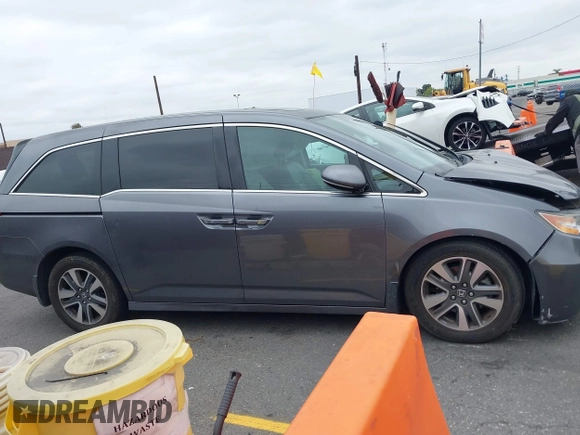 2014 Honda Odyssey Touring with VIN 5FNRL5H97EB114634, listed as a IAAI auction lot 42105220 with Not Provided miles and . Bid and sale history available at carsss.com. Image 12.
