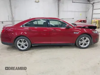 2015 Ford Taurus SEL z VIN 1FAHP2H88FG163179, wystawiony jako IAAI lot #42345579 z przebiegiem 142 424 mil mil oraz . Historia ofert i sprzedaży dostępna na DreamBid. Obrazek 13.