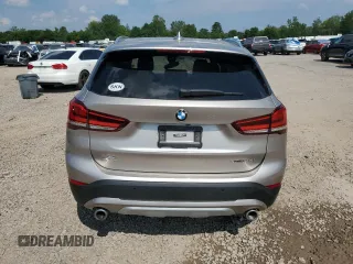 2021 BMW X1 xDrive28i with VIN WBXJG9C09M5S52289, listed as a Copart auction lot 64413105 with Not provided miles and Salvage title. Bid and sale history available at DreamBid. Image 6.