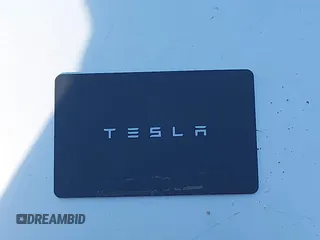 2018 Tesla Model 3 Long Range Battery with VIN 5YJ3E1EA0JF056979, listed as a IAAI auction lot 41865849 with 97,319 mi miles. Bid and sale history available at carsss.com. Image 11.