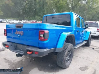 2023 Jeep Gladiator Mojave with VIN 1C6JJTEG0PL593061, listed as a IAAI auction lot 40287955 with 3,930 mi miles. Bid and sale history available at carsss.com. Image 4.