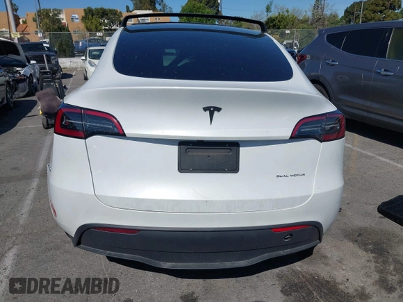 2023 Tesla Model Y Long Range with VIN 7SAYGDEEXPA152986, listed as a IAAI auction lot 41946665 with 13,574 mi miles and . Bid and sale history available at carsss.com. Image 16.