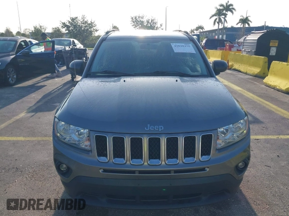 2011 Jeep Compass with VIN 1J4NT1FA4BD213994, listed as a IAAI auction lot 42020375 with 84,409 mi miles. Bid and sale history available at carsss.com. Image 6.