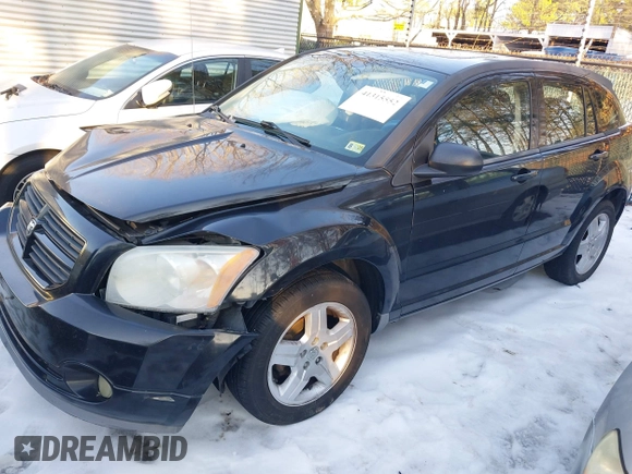 2009 Dodge Caliber SXT with VIN 1B3HB48A89D118869, listed as a IAAI auction lot 41315552 with 198,986 mi miles and . Bid and sale history available at DreamBid. Image 2.