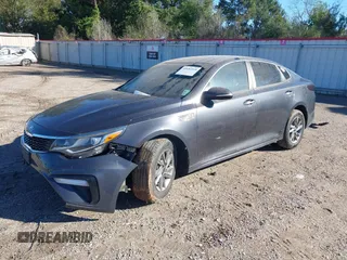2019 Kia Optima LX with VIN 5XXGT4L3XKG292437, listed as a IAAI auction lot 40682048 with 151,012 mi miles. Bid and sale history available at carsss.com. Image 2.