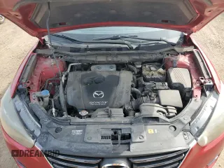 2016 Mazda CX-5 Grand Touring z VIN JM3KE2DY2G0705650, wystawiony jako Copart lot #53808365 z przebiegiem 123 611 mil mil oraz Szkoda całkowita • Salvage title. Historia ofert i sprzedaży dostępna na DreamBid. Obrazek 13.