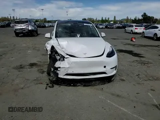 2022 Tesla Model Y Performance с VIN 7SAYGDEF2NF405596, выставлен на аукционе Copart как лот 52868195 с пробегом Не указан миль и Списание • Salvage title. История ставок и продаж доступна на DreamBid. Изображение 11.