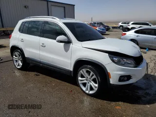 2012 Volkswagen Tiguan SE with VIN WVGAV7AX1CW530016, listed as a Copart auction lot 48551935 with 102,455 mi miles and Salvage Title. Bid and sale history available at DreamBid. Image 4.