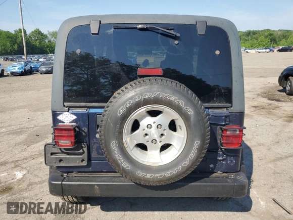 2003 Jeep Wrangler Sport z VIN 1J4FA49S13P347815, wystawiony jako Copart lot #59536685 z przebiegiem 74 298 mil mil oraz Szkoda całkowita • Salvage title. Historia ofert i sprzedaży dostępna na DreamBid. Obrazek 6.