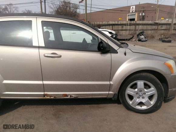 2009 Dodge Caliber SXT with VIN 1B3HB48A59D241061, listed as a IAAI auction lot 41801504 with 158,165 mi miles. Bid and sale history available at carsss.com. Image 13.