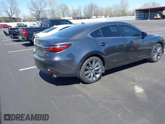 2020 Mazda 6 Grand Touring with VIN JM1GL1TY0L1522025, listed as a IAAI auction lot 41876429 with 68,101 mi miles and . Bid and sale history available at DreamBid. Image 4.