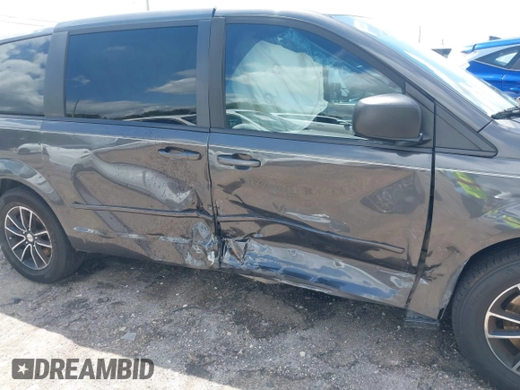 2015 Dodge Grand Caravan American Value with VIN 2C4RDGBGXFR682995, listed as a IAAI auction lot 41994708 with 142,725 mi miles and . Bid and sale history available at DreamBid. Image 6.
