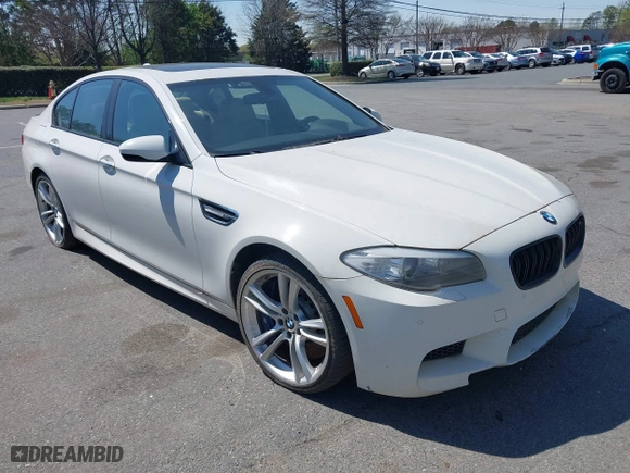 2013 BMW M5 with VIN WBSFV9C58DC773268, listed as a IAAI auction lot 41890830 with 128,399 mi miles. Bid and sale history available at carsss.com. Image 1.