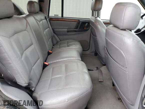 1997 Jeep Grand Cherokee Limited z VIN 1J4GZ78Y8VC586034, wystawiony jako Copart lot #58061705 z przebiegiem 244 355 mil mil oraz Czysty tytuł • Clean title. Historia ofert i sprzedaży dostępna na DreamBid. Obrazek 11.