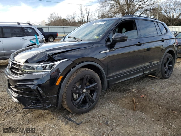 2023 Volkswagen Tiguan SE R-Line Black with VIN 3VVCB7AX9PM131559, listed as a Copart auction lot 44711665 with 28,166 mi miles and Salvage Title. Bid and sale history available at carsss.com. Image 1.