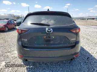 2021 Mazda CX-5 Touring z VIN JM3KFBCM5M0438706, wystawiony jako Copart lot #52048075 z przebiegiem 50 288 mil mil oraz Szkoda całkowita • Salvage title. Historia ofert i sprzedaży dostępna na DreamBid. Obrazek 6.