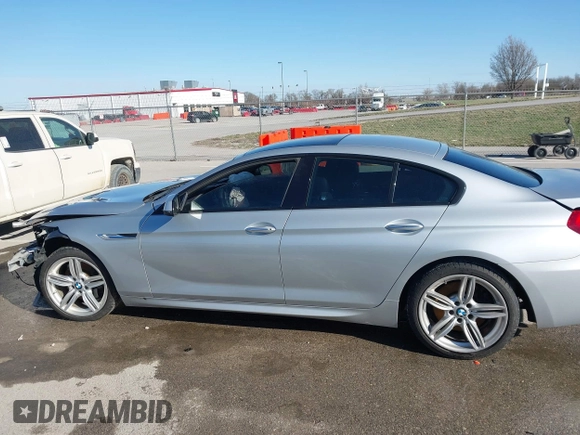 2015 BMW 6 Series 640i xDrive with VIN WBA6B8C52FD453433, listed as a IAAI auction lot 41805317 with 138,685 mi miles and . Bid and sale history available at carsss.com. Image 14.