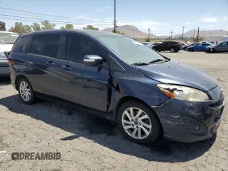 2014 Mazda 5 Sport with VIN JM1CW2BL2E0169071, listed as a Copart auction lot 67702854 with 182,219 mi miles and Clean Title. Bid and sale history available at DreamBid. Image 4.