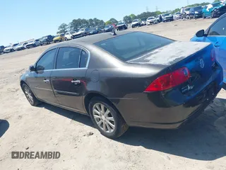 2009 Buick Lucerne CXL with VIN 1G4HD57M59U122626, listed as a IAAI auction lot 42004989 with 184,026 mi miles. Bid and sale history available at carsss.com. Image 3.