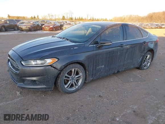 2015 Ford Fusion SE Hybrid with VIN 3FA6P0LU1FR219908, listed as a IAAI auction lot 41272688 with 310,452 mi miles. Bid and sale history available at carsss.com. Image 18.
