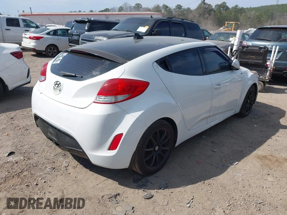 2014 Hyundai Veloster with VIN KMHTC6AD1EU217707, listed as a IAAI auction lot 41718176 with 191,306 mi miles. Bid and sale history available at carsss.com. Image 4.