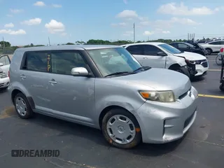 2012 Scion xB z VIN JTLZE4FEXCJ024201, wystawiony jako IAAI lot #42370997 z przebiegiem 97 981 mil mil oraz . Historia ofert i sprzedaży dostępna na DreamBid. Obrazek 1.
