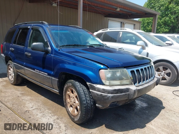 2003 Jeep Grand Cherokee Laredo with VIN 1J4GX48S83C548090, listed as a IAAI auction lot 42039918 with 243,209 mi miles. Bid and sale history available at carsss.com. Image 1.