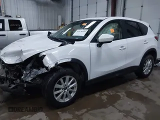 2014 Mazda CX-5 Touring with VIN JM3KE4CY4E0349034, listed as a IAAI auction lot 41478954 with 117,502 mi miles. Bid and sale history available at carsss.com. Image 2.