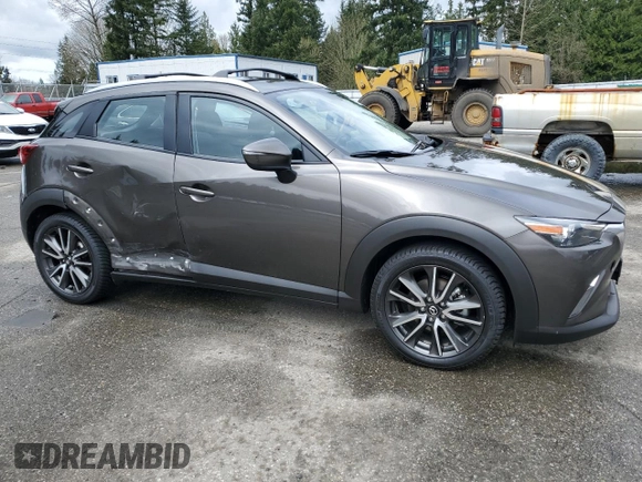 2017 Mazda CX-3 Touring with VIN JM1DKFC79H0148103, listed as a Copart auction lot 51343025 with 79,765 mi miles and Salvage Title. Bid and sale history available at DreamBid. Image 4.