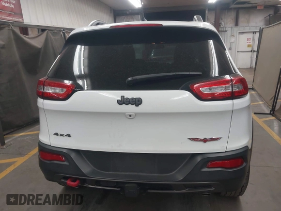 2015 Jeep Cherokee Trailhawk with VIN 1C4PJMBS1FW665500, listed as a IAAI auction lot 42068268 with 127,246 mi miles. Bid and sale history available at carsss.com. Image 17.