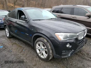 2015 BMW X4 xDrive28i with VIN 5UXXW3C54F0M89256, listed as a Copart auction lot 41388973 with 136,359 mi miles. Bid and sale history available at carsss.com. Image 4.