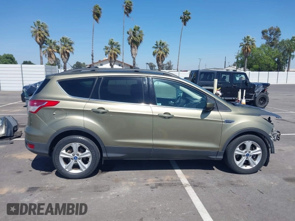 2013 Ford Escape SE with VIN 1FMCU0G99DUC05901, listed as a IAAI auction lot 42194672 with 121,435 mi miles and . Bid and sale history available at DreamBid. Image 14.
